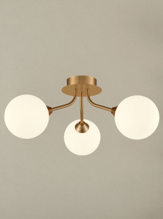 Cosmic 3 light fitting in antique gold with matt opal glass