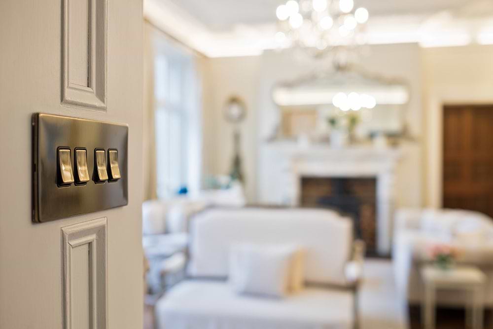 The Charterhouse Collection 4 Gang Intermediate switch Blk Ins Screwless Antique Brass