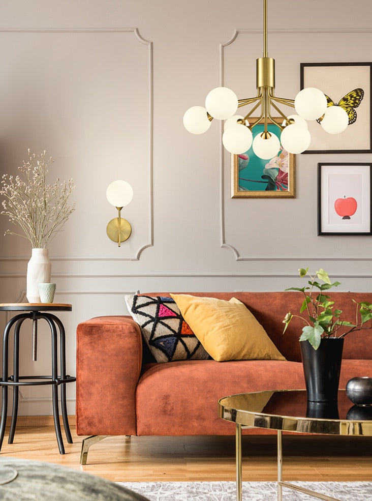 Cosmic 1 light wall bracket in antique gold with matt opal glass