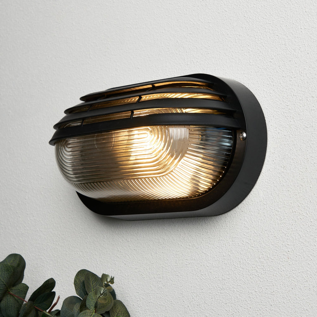 Puck Oval Outdoor Bulkhead Eyelid Wall Light, Black