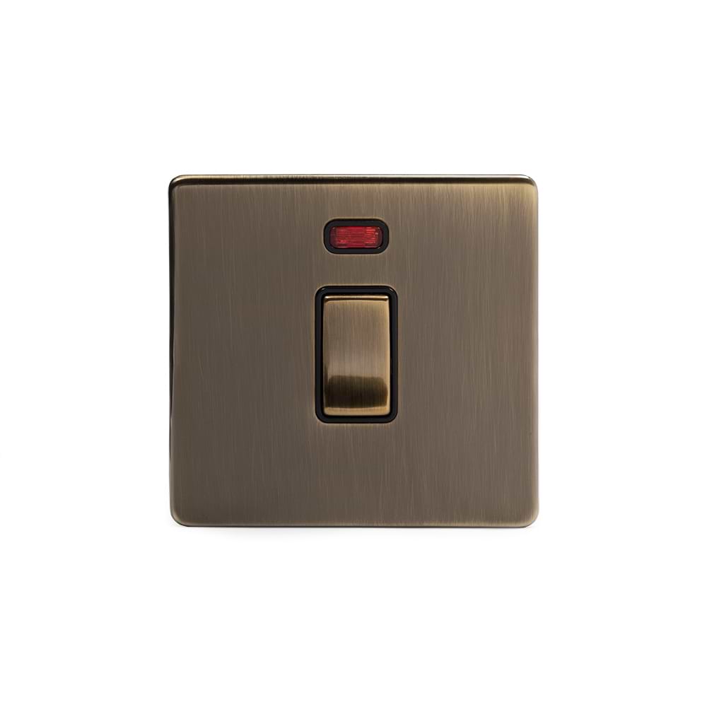 The Charterhouse Collection 20A 1 Gang Double Pole Switch With Neon Blk Ins Screwless  Antique Brass