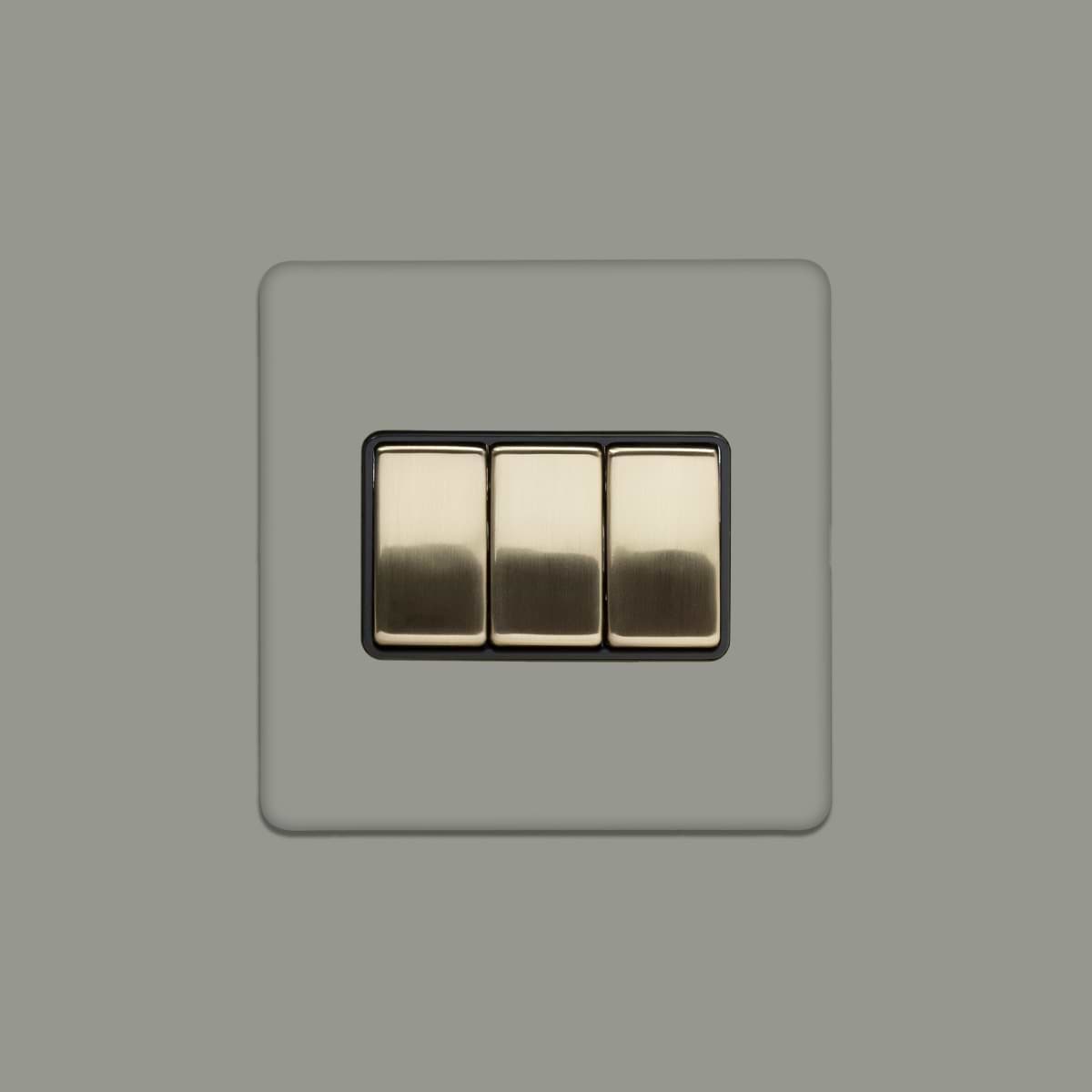 Soho Lighting Primed Paintable 3 Gang Intermediate switch with Brushed Brass Switch with Black Insert